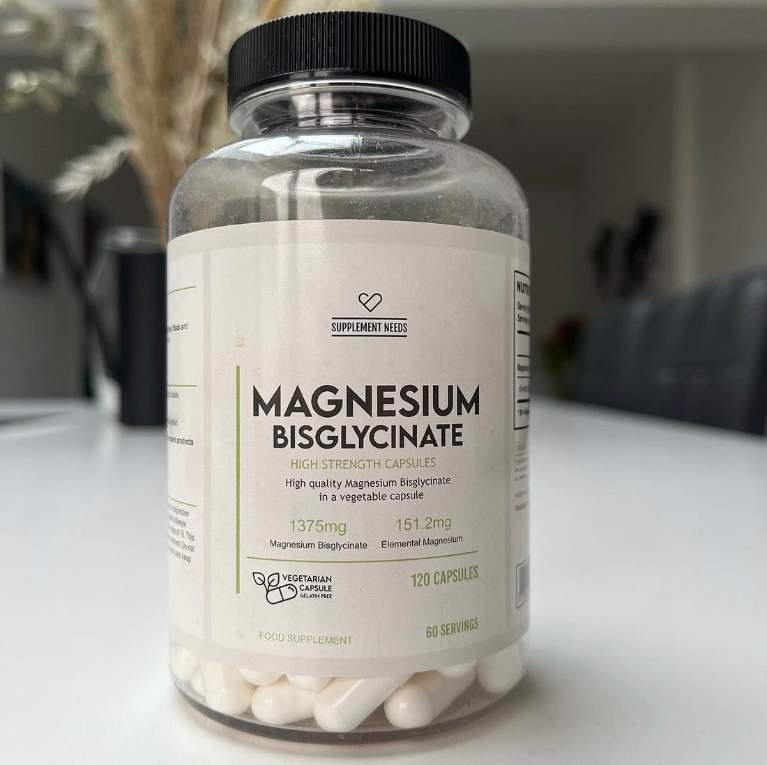 Supplement Needs Magnesium Bisglycinate tub on a table