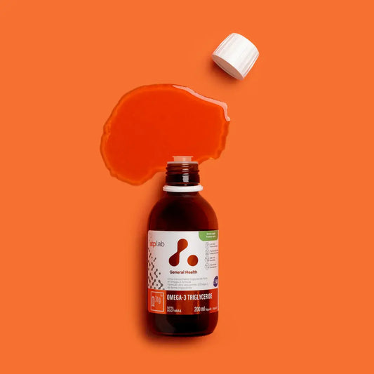ATP LAB Omega-3 Triglyceride bottle with spilled oil on orange background, providing essential fatty acids for health.